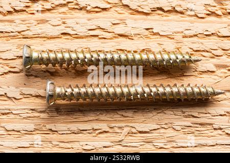 Screws on wooden background. Closeup photo Stock Photo