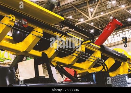 A drilling rig mounted on a truck, featuring a yellow boom and drilling mechanism. This equipment used for well drilling, geological exploration, or o Stock Photo