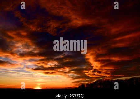 Dramatic clouds and sunset over a Lincolnshire field. Stock Photo