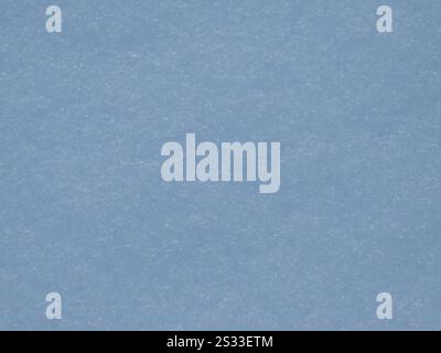 light blue snow background with light sparkling surface texture, airy shining backdrop, fresh snow crust as natural texture space Stock Photo