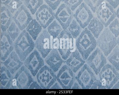 rhombus and simple flowers and abstracts print on hard textured surface, gray blue geometric pattern in simple oriental style, graphic abstraction Stock Photo