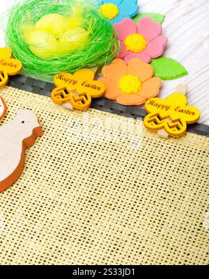 Easter eggs on a burlap background. Easter decoration. Place for text. Stock Photo