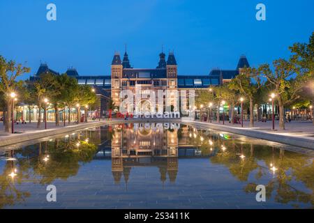 Rijksmuseum in Amsterdam, The Netherlands during blue hour. Architect: Pierre Cuypers. Stock Photo