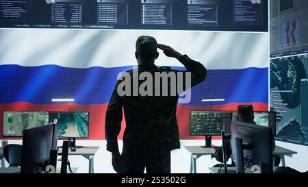 Army IT expert in control center collecting real time battlefield data, process satellite surveillance imagery for successful military defense mission. Using green screen isolated display. Camera A. Stock Photo