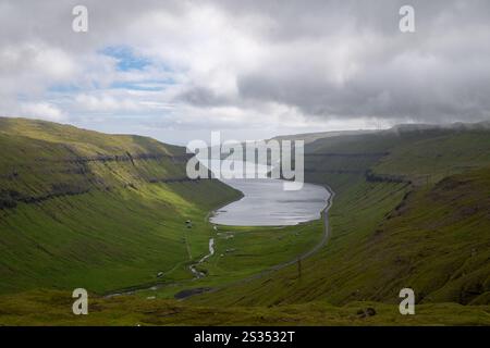 Aerial panoramic view over Kaldbaksbotnur, typical Faroese landscape. Stock Photo