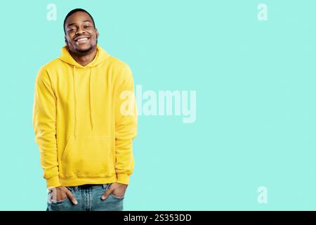 Happy African Guy Posing With Hands In Pockets, Blue Background Stock Photo