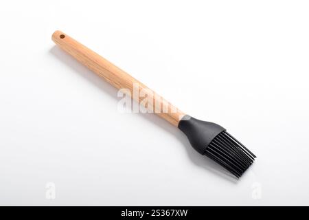Kitchen silicone brush isolated on white background. Cooking brush for spreading oil on food. Kitchen utensils and utensils. Stock Photo