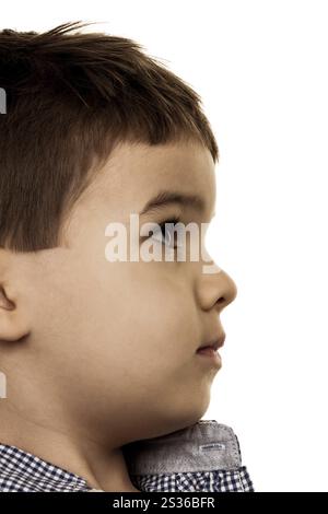 Little boy looks uncertain, symbol of childhood, innocence, scepticism Stock Photo