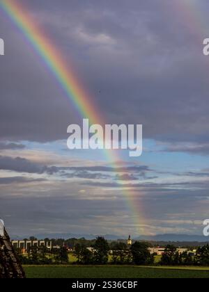 A rainbow appears in the sky after a thunderstorm Stock Photo - Alamy