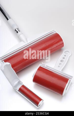 Sticky lint rollers of different sizes isolated on white background Stock Photo