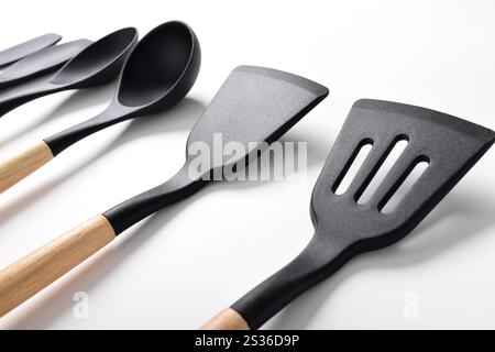 Silicone cooking utensils set with wooden handle isolated on white background. Kitchen tool sets Stock Photo