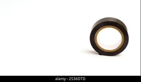 A Black Adhesive Tape On A White Background Isolated, Photographed With Composition Leaving Space On The Left Side Stock Photo