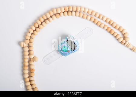 Tasbih. Digital prayer beads hand tally counter and Wooden prayer beads isolated on white background. Used by Muslims in worship especially in the hol Stock Photo