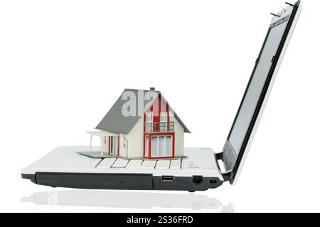 House on computer tastaur, symbolic photo for property and housing market on the Internet Austria Stock Photo