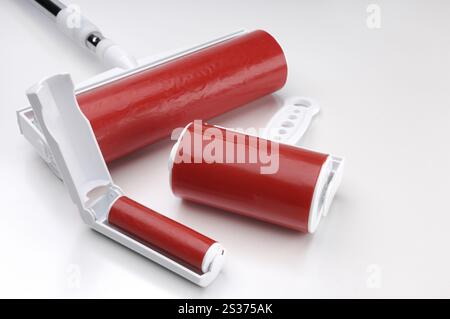 Sticky lint rollers of different sizes isolated on white background Stock Photo