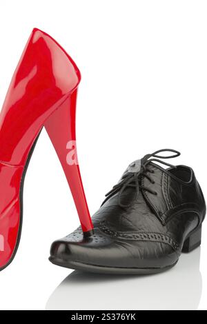 Women's shoe on men's shoe, symbolic photo for separation, divorce and conflict Austria Stock Photo