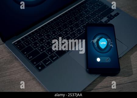VPN A man is typing on a laptop VPN Virtual Private Network protocol concept cyberspace network online Stock Photo