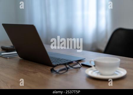 close up view of computer a cup of coffee on a table working lifestyle Stock Photo