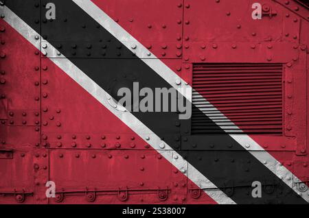 Trinidad and Tobago flag depicted on side part of military armored tank close up. Army forces conceptual background. Trinidad and Tobago flag Stock Photo