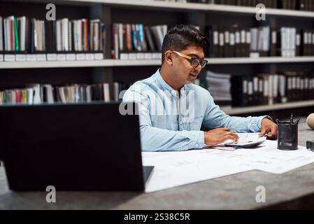 Paperwork, business man and architect with calculator for planning blueprint or construction project cost. Office, engineer and electronic calculation Stock Photo
