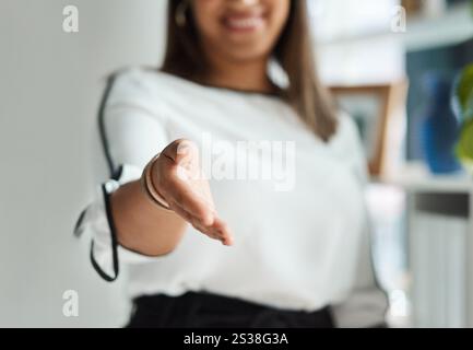 Deal, offer and businesswoman with handshake gesture in office for welcome, greeting or merger. Partnership, agreement and female attorney with Stock Photo