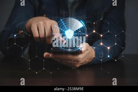 A person uses a touch screen of a smartphone. Concept of information protection, personal data. Remote control using modern technologies. Stock Photo