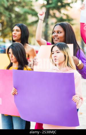 Accelerate Action Women protesting together for equal rights and inclusion on 8m march Stock Photo