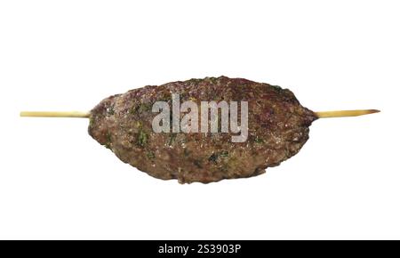 Succulent grilled kofta kebab on a wooden skewer against an isolated white background. Grilled kofta kebab on a skewer isolated Stock Photo
