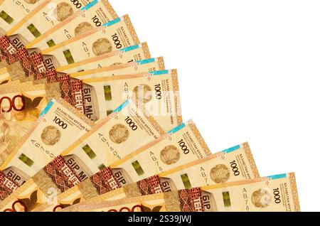 1000 Kazakhstani tenge bills lies isolated on white background with copy space stacked in fan close up. Payday time concept or financial operations. Stock Photo