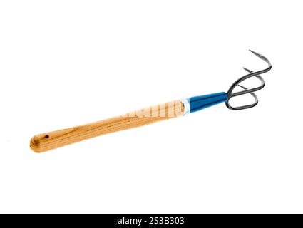 Rake hanging isolated on white background. Rake hanging isolated on white Stock Photo