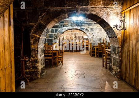 interior of old tavern in stone underground floor ancient urban house Stock Photo