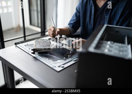 IT Engineer installing Hardware Equipment Development Facility Engineer  Maintenance computer Motherboard Electronic repair shop technology business. Stock Photo