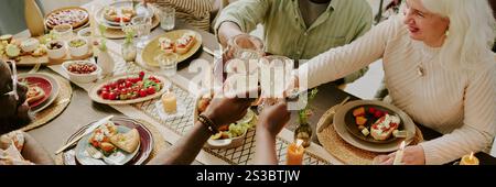 Website banner with biracial family clinking glasses with champagne Stock Photo