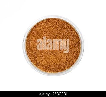 Pile of coconut palm sugar isolated on a white background. Coco sap sugar or coconut blossom. Coconut palm sugar as a sprinkle for cakes and pies. Stock Photo