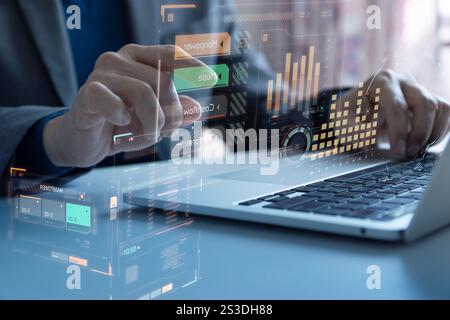 Close-up of a businessman or analyst interacting with futuristic  computer user interface  while analysing business information for investment risk an Stock Photo