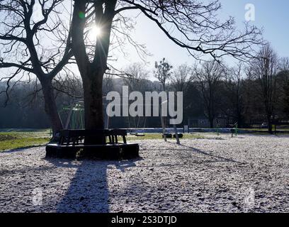 Frost lingers over parts of the Rye Adventure Playground as the midday sun rises above High Wycombe, Buckinghamshire, UK. Britons are braced for the mercury to plummet as low as minus 16C, with weather warnings for snow and ice are in force across much of the UK after severe flooding and snow caused travel disruption and school closures. Picture date: Thursday January 9, 2025. Stock Photo