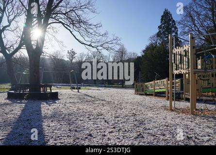 Frost lingers over parts of the Rye Adventure Playground as the midday sun rises above High Wycombe, Buckinghamshire, UK. Britons are braced for the mercury to plummet as low as minus 16C, with weather warnings for snow and ice are in force across much of the UK after severe flooding and snow caused travel disruption and school closures. Picture date: Thursday January 9, 2025. Stock Photo