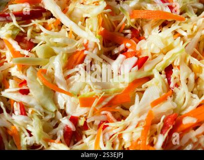 Chopped vegetables. Finely chopped cabbage, carrots and peppers. Stock Photo