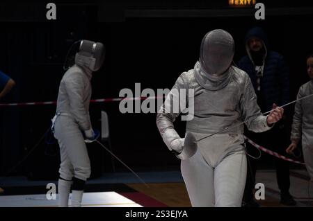 Two fencing champions clash in an intense tournament match, showcasing their skill and precision in this thrilling sport Stock Photo