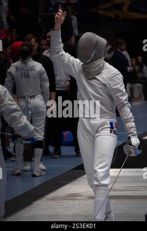 Two fencing champions clash in an intense tournament match, showcasing their skill and precision in this thrilling sport Stock Photo