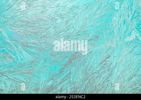 Macro photo imitation of intricate frost crystals forming unique patterns on glass. Perfect for winter themes and artistic design projects. Stock Photo