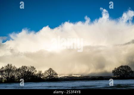 Impressive stormy snow cloud formations over the Ribble Valley and Pendle Hill, Lancashire, UK Stock Photo