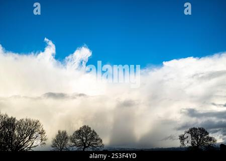 Impressive stormy snow cloud formations over the Ribble Valley and Pendle Hill, Lancashire, UK Stock Photo