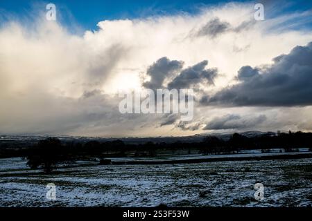 Impressive stormy snow cloud formations over the Ribble Valley and Pendle Hill, Lancashire, UK Stock Photo