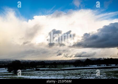 Impressive stormy snow cloud formations over the Ribble Valley and Pendle Hill, Lancashire, UK Stock Photo