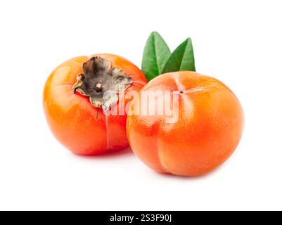 persimmon  with leaves on white background. Stock Photo