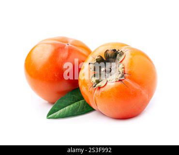 persimmon  with leaves on white background. Stock Photo