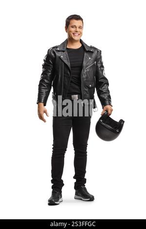 Smiling man in leather jacket holding a motorbike helmet isolated on white background Stock Photo
