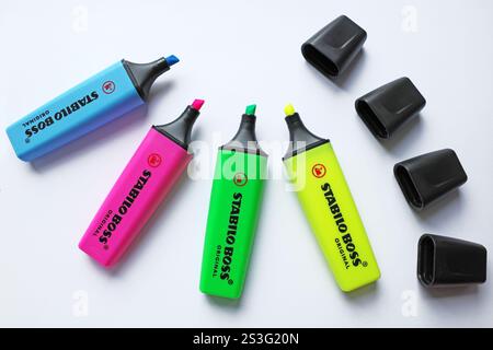 Itterbeck, Germany - Oct 12 2024 Open stabilo boss highlighters in 4 colors: yellow, green,  pink, blue.  Isolated on white background, top view Stock Photo