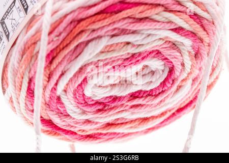 Colorful ball of pink and white yarn end close up. High quality photo Stock Photo